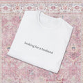 Looking for a Husband Minimalist T‑Shirt – Black Typography Funny Quote, Gift for Singles & Bridesmaids